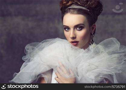 creative fashion shoot with romantic retro atmosphere of sensual elegant girl with precious jewellery, antique dress with frill veil collar and charming make-up