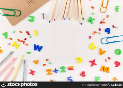 Creative flat lay back to school concept with color school and office supplies on white table background with copy space, frame, template for text or design