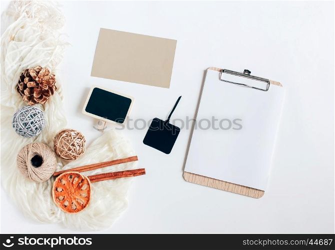 Creative flat lay of blank clipboard, card, blackboard and tag with autumn ornaments on white background, top view