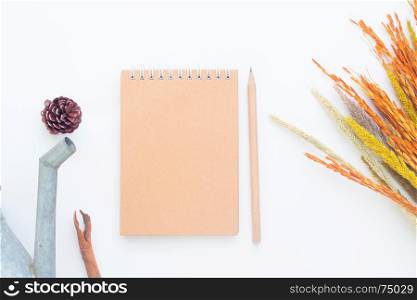 Creative flat lay of blank notebook and pencil on white background, Autumn lifestyle