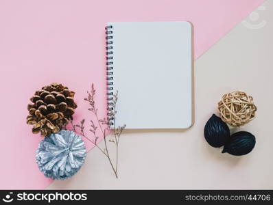 Creative flat lay of craft and blank notebook mock up on colorful background, top view