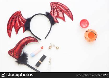 Creative flat lay of halloween concept on white background