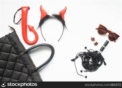 Creative flat lay of Halloween fashion set on white background, Woman accessories in red and black, Halloween party
