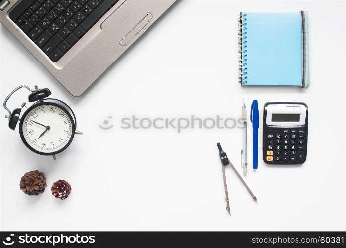 Creative flat lay of school supplies and laptop on white background with copy space