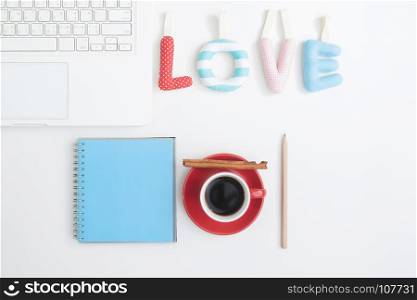 Creative flat lay of sewed pillow in love quote on workspace, Love and Valentine concept