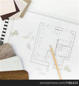 Creative flat lay overhead top view blueprints architectural flat project plan and office supplies on decorator square white table workspace swatches tools and equipment background copy space concept