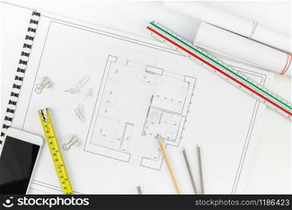 Creative flat lay overhead top view blueprints architectural flat project plan and office supplies on decorator white table workspace with swatches tools and equipment background copy space concept