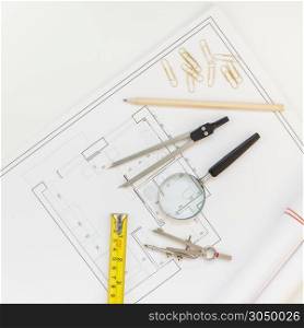 Creative flat lay overhead top view blueprints architectural flat project plan and office supplies on decorator square table workspace with swatches tools and equipment background copy space concept