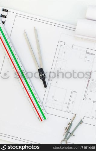 Creative flat lay overhead top view blueprints architectural flat project plan and office supplies on decorator white table workspace with swatches tools and equipment background copy space concept