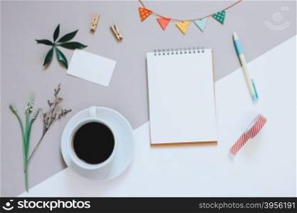 Creative flat lay photo of cute workspace desk with notebook, coffee, name card and decorated cute craft with copy space background, minimal style&#xD;