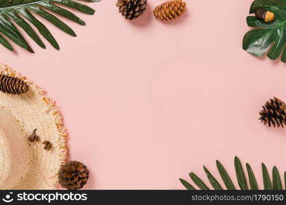 Creative flat lay photo of travel vacation spring or summer tropical fashion. Top view beach accessories on pastel pink color background with blank space for text. Top view copy space photography.