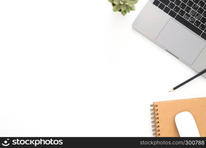 Creative flat lay photo of workspace desk. Top view office desk with laptop, pencil, notebook and plant on white color background. Top view with copy space, flat lay photography.