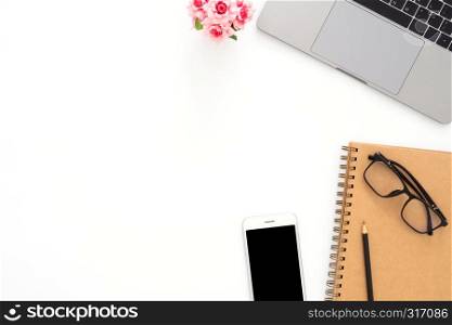 Creative flat lay photo of workspace desk. Top view office desk with laptop, glasses, phone, pencil, notebook and plant on white color background. Top view with copy space, flat lay photography.