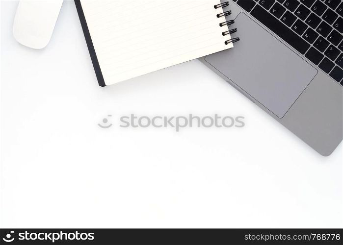 Creative flat lay photo of workspace desk. Top view office desk with laptop and notebook on white color background. Top view with copy space, flat lay photography.