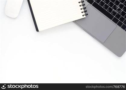 Creative flat lay photo of workspace desk. Top view office desk with laptop and notebook on white color background. Top view with copy space, flat lay photography.