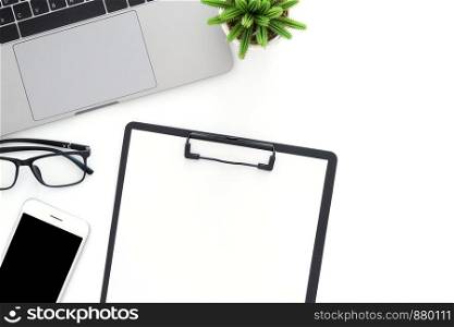 Creative flat lay photo of workspace desk. Top view office desk with laptop, phone, blank clipboard and plant on white color background. Top view with copy space, flat lay photography.
