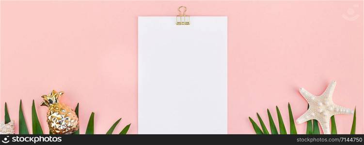 Creative flat lay top view mock up green tropical palm leaves coconuts blank paper pink postcard clip board background copy space. Minimal tropical palm leaf plants summer travel concept template