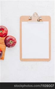 Creative flat lay top view mockup of exotic spanish made tomatoes Mar Azul on white wooden table background copy space. Minimal house cooking concept mock up for blog or recipe book