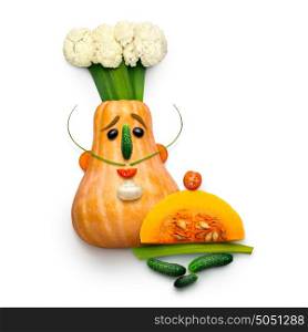 Creative food concept of a funny cartoon chef made of vegetables on white background.