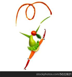 Creative food concept of a gymnast made of vegetables and fruits isolated on white.