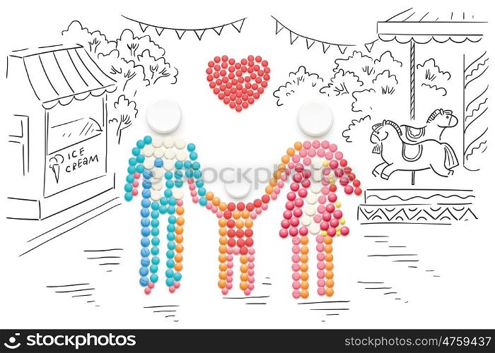 Creative healthcare concept made of drugs and pills, on sketchy background. Family holding hands.