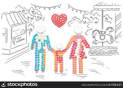 Creative healthcare concept made of drugs and pills, on sketchy background. Family holding hands.