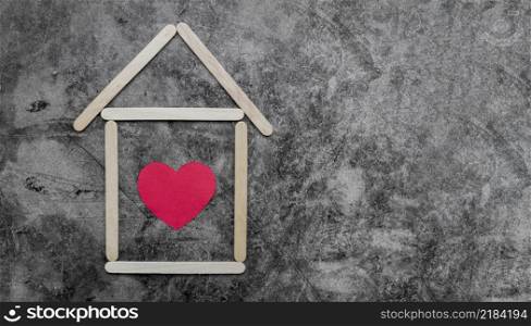 creative ice cream wooden sticks house with red heart old wall