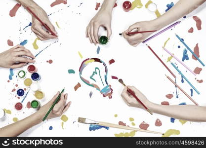 Creative idea for your business. Top view of hands drawing business creative concept with paints