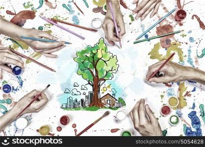 Creative idea for your business. Top view of hands drawing business creative concept with paints