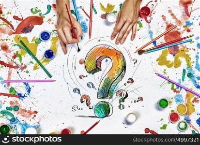 Creative ideas for your business. Top view of hands drawing question mark concept