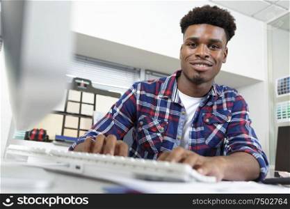 creative man working in office on laptop