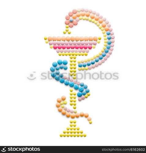 Creative medicine and healthcare concept made of drugs and pills, isolated on white. Snake with a bowl, Bowl of Hygieia as one of the symbols of pharmacy