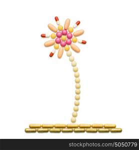 Creative medicine and healthcare concept made of pills, flower isolated on white.