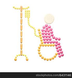 Creative medicine and healthcare concept made of pills in the shape of a patient with wheelchair on white background.