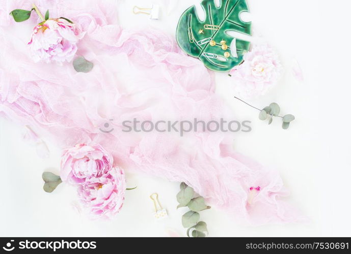 Creative moern wedding composition mock up, pink blanket, flowers, eucalyptus branches on white desk background. Flat lay, top view stylish art concept.. Creative wedding composition