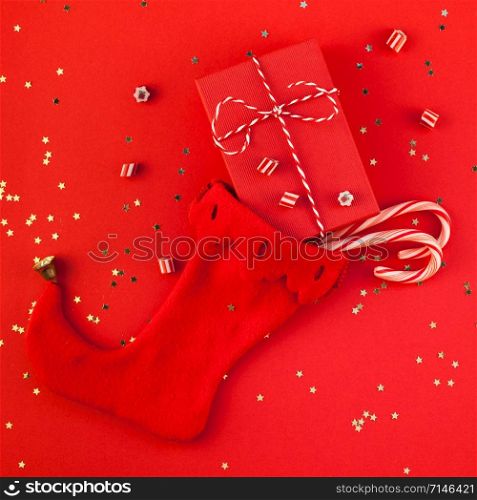 Creative New Year Christmas presents wrapped ribbon flat lay top view Xmas 2019 holiday celebration handmade gift boxes noel stocking red paper background. Square Template greeting card text design