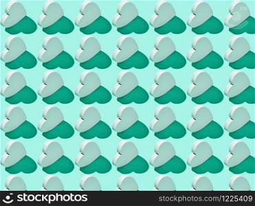 Creative pattern from plaster vertical standing hearts on a light turquoise background with hard shadows. Valentine&rsquo;s greeting card.. Festive pattern from gypsum hearts with hard shadows.