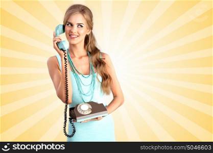 Creative photo of a pretty pin-up girl speaking via vintage phone on colorful abstract cartoon style background.