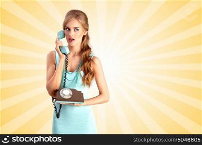 Creative photo of a pretty pin-up girl speaking via vintage phone on colorful abstract cartoon style background.