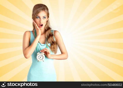 Creative photo of a shocked pin-up girl being late and holding a retro alarm clock on colorful abstract cartoon style background.
