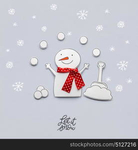 Creative photo of a snowman made of paper on grey background.