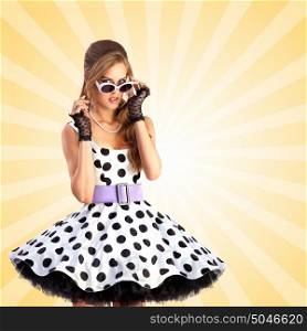 Creative photo of a vogue pin-up girl, dressed in a retro polka-dot dress and sunglasses, posing on colorful abstract cartoon style background.