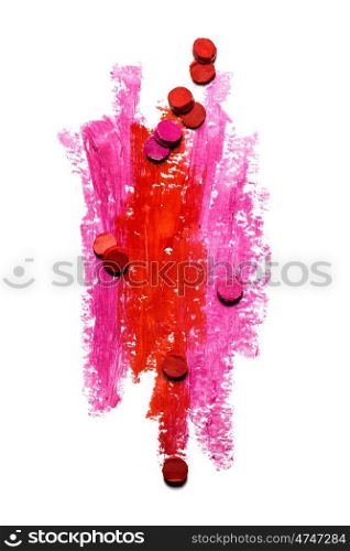 Creative photo of an abstract red and pink strokes with slices of lipstick isolated on white.