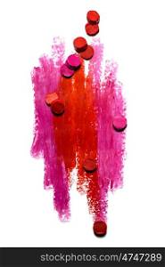 Creative photo of an abstract red and pink strokes with slices of lipstick isolated on white.