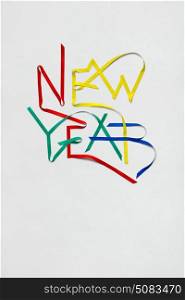 Creative photo of new year sign made of paper on white background.