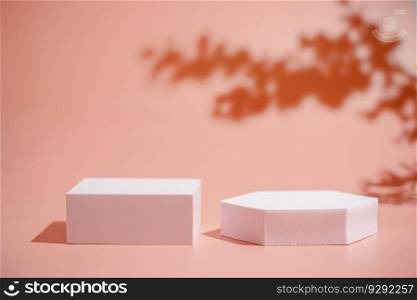 Creative round pink platform podium for cosmetics or products with shadowes of greens branches on pink background. Front view. Platform podium for cosmetics