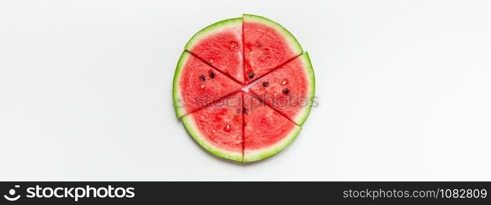 Creative scandinavian style flat lay top view of fresh watermelon slices on white table background copy space. Minimal summer fruits creative for blog or recipe book