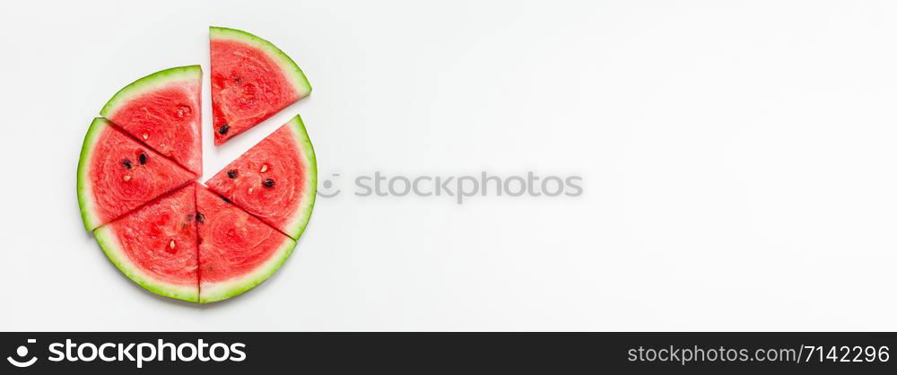 Creative scandinavian style flat lay top view of fresh watermelon slices on white table background copy space. Minimal summer fruits creative for blog or recipe book