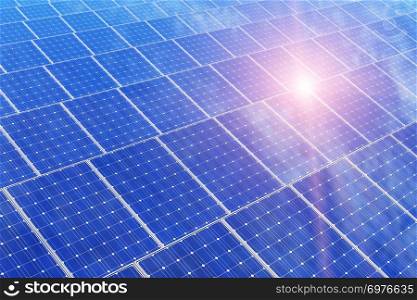 Creative solar power generation technology, alternative energy and environment protection ecology business concept: 3D render illustration of the group of solar battery panels against blue sky with sun light