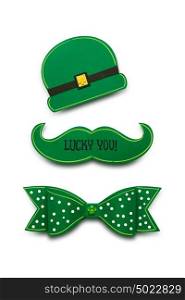 Creative St. Patricks Day concept photo of a moustache, bow and hat made of paper on white background.